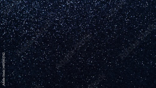 Fast moving side-to-side dark blue sparkly background space-like stars constantly glistening  photo