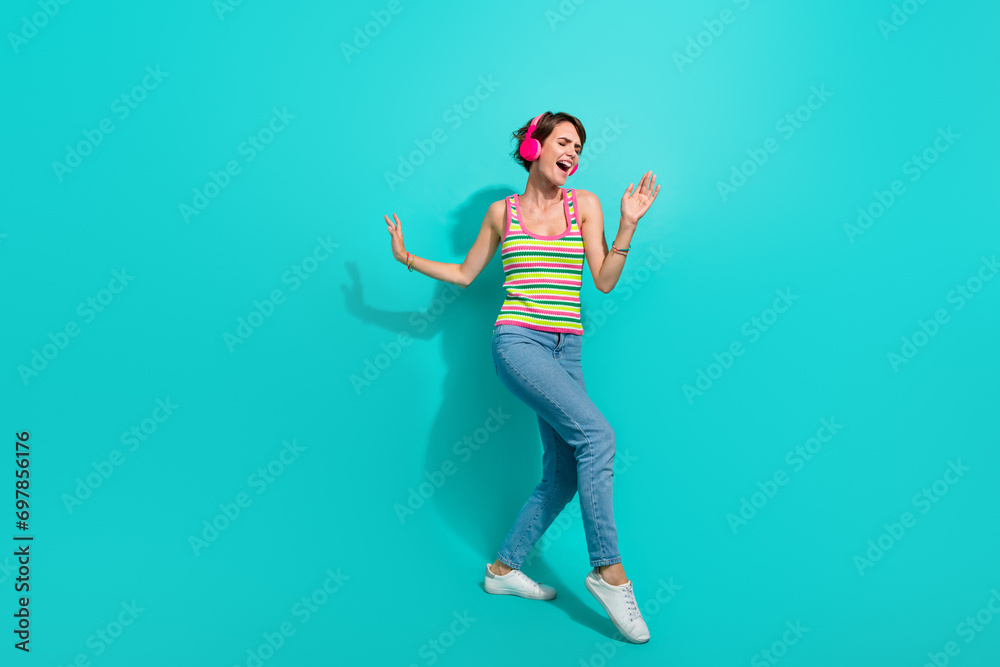 Full length photo of overjoyed cheerful person have fun dancing rejoice isolated on teal color background