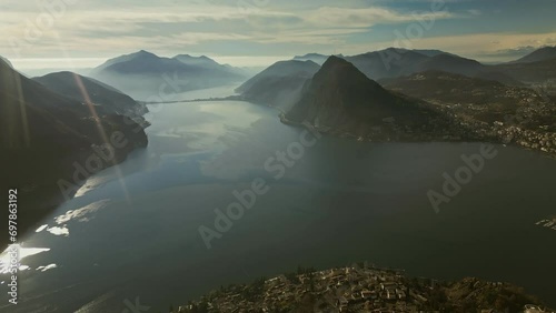 Lugano, Switzerland. Aerial view of the Swiss city, surrounded by lake and mount photo