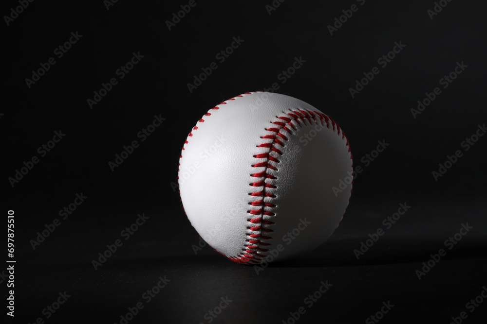 One leather baseball ball on black background One leather baseball ball on black background