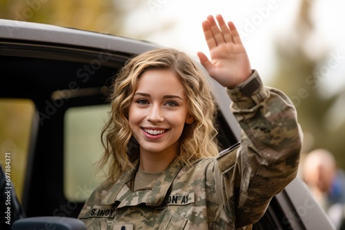 Smiling Military Personnel Waving Goodbye Before Deployment photo