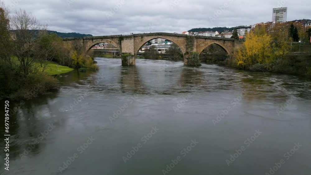 Low dolly push in to Ourense Roman Bridge on Miño River in Ourense, Galicia, Spain Low dolly push in to Ourense Roman Bridge on Miño River in Ourense, Galicia, Spain