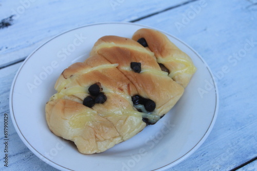 Banana vanilla cheese bread with chocochips in a plate on the table photo