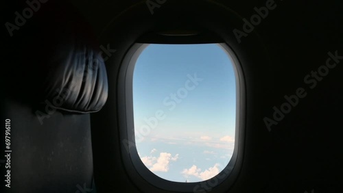 airplane flight flying trip travel above clear blue sky with beautiful cloud, looking at view through window of plane
