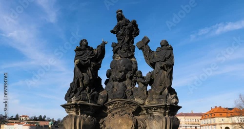 Statues of Madonna, Saint Dominic and Thomas Aquinas on Charles Bridge in Prague, Czech Republic photo