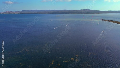 Aerial view of Kite surfing at Punta Trettu, San Giovanni Suergiu, South Sardinia, Italy photo