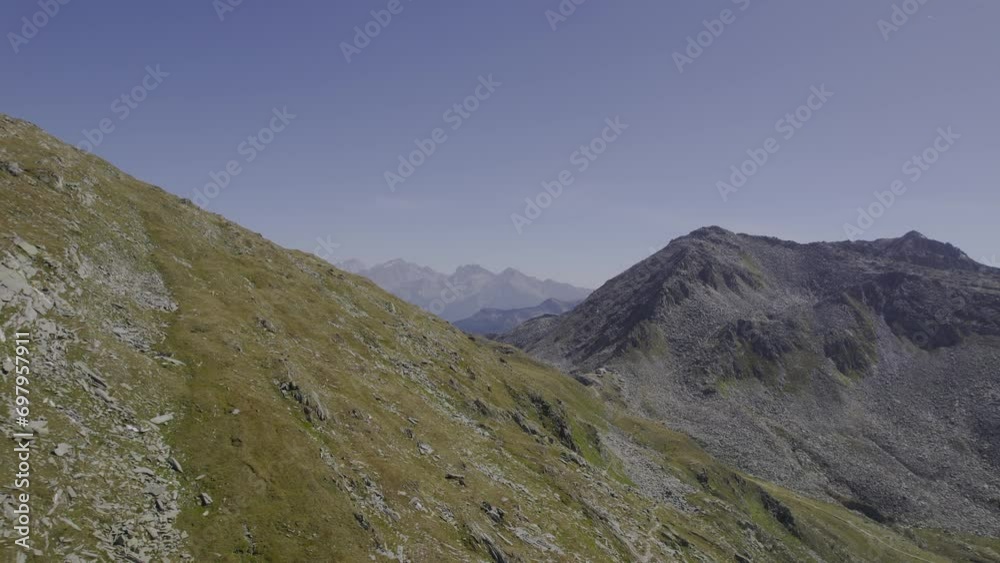 Drone unveils the distant Rifugio Porro, also knows as Chemnitzer Hütte or Nevesjochhütte, in the South Tyrol Zillertal Alps. Drone unveils the distant Rifugio Porro, also knows as Chemnitzer Hütte or Nevesjochhütte, in the South Tyrol Zillertal Alps.