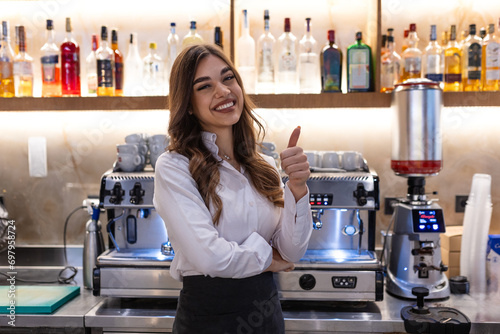 Coffee Business owner Concept - attractive young beautiful barista with apron in coffee shop counter.