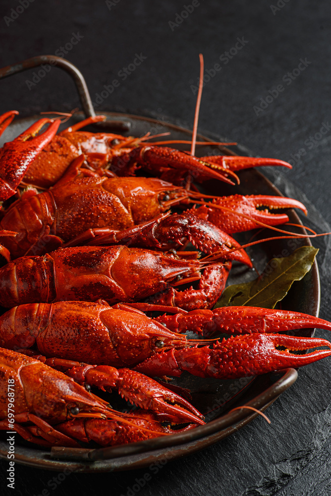 boiled crayfish on a black plate boiled crayfish on a black plate