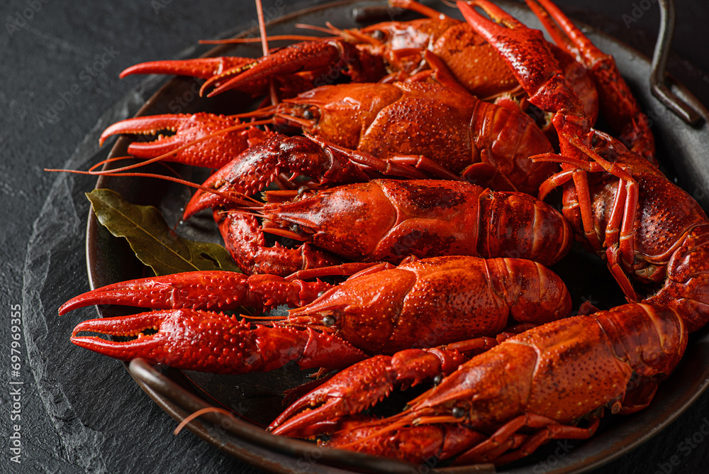boiled crayfish on a black plate boiled crayfish on a black plate