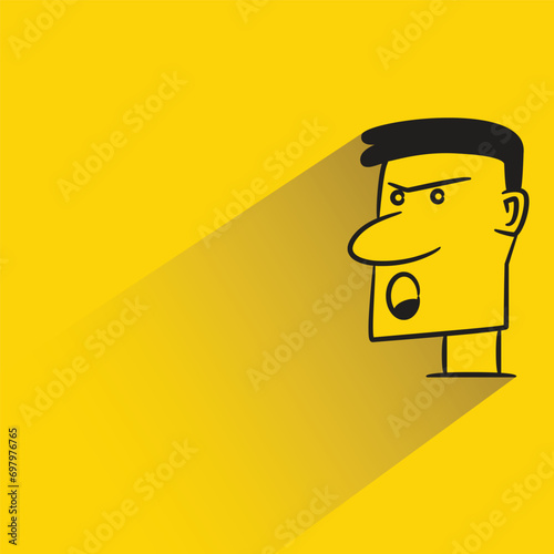 angry face with shadow on yellow background