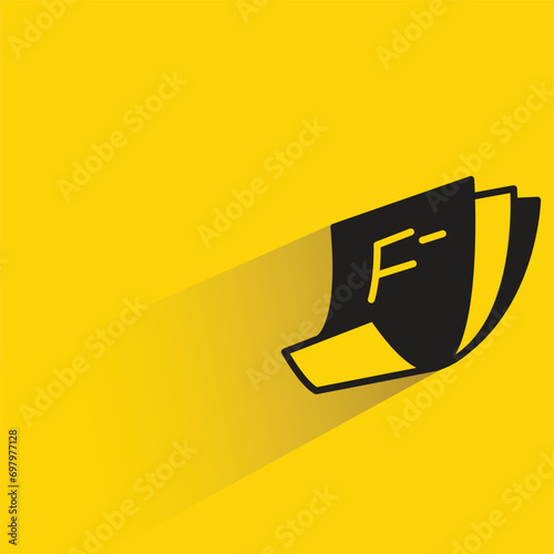 false grade document with shadow on yellow background