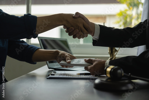 Businessman shaking hands thankfully closing a deal with his lawyer to discuss contract terms Good cooperation in counseling between lawyers, close-up photo photo
