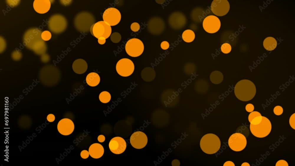 Group of animated orange circle particles moving on bokeh background