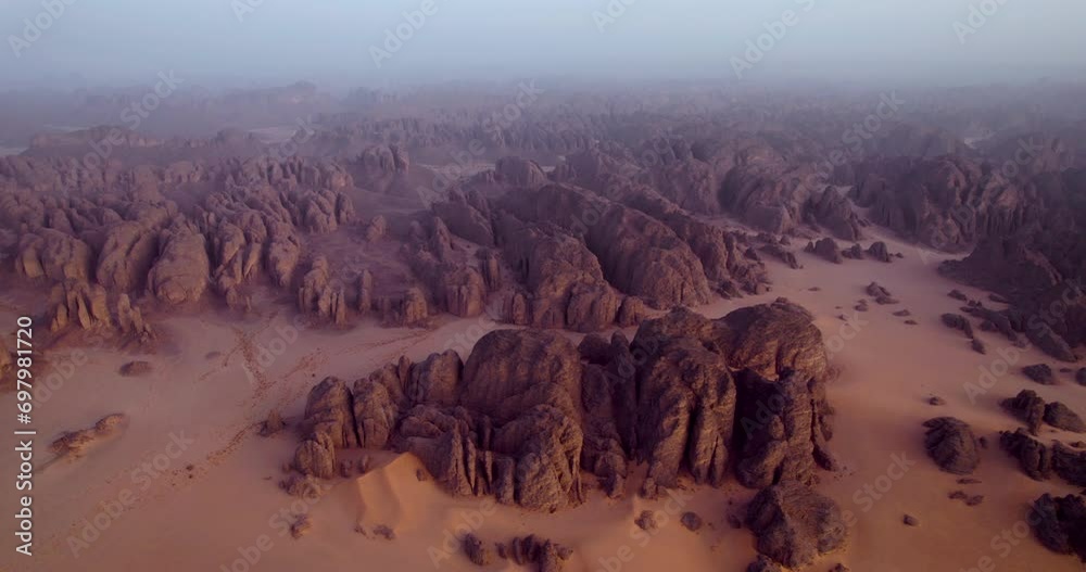 Foggy Landscape Of Tassili n'Ajjer National Park At Sunrise In Djanet, Algeria. - aerial