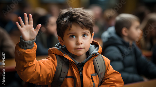 A simple yet impactful image of a young boy in a classroom, raising his hand with enthusiasm to answer a question or participate in a discussion. Generative AI