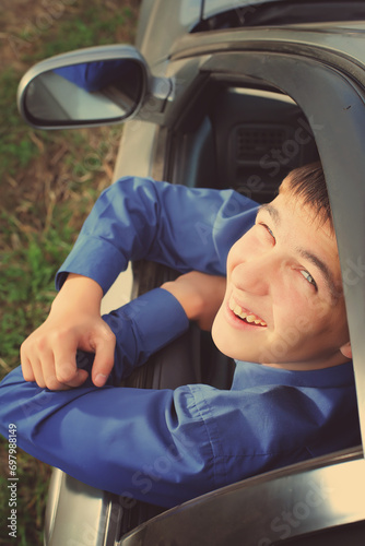 Happy Young Man in a Car