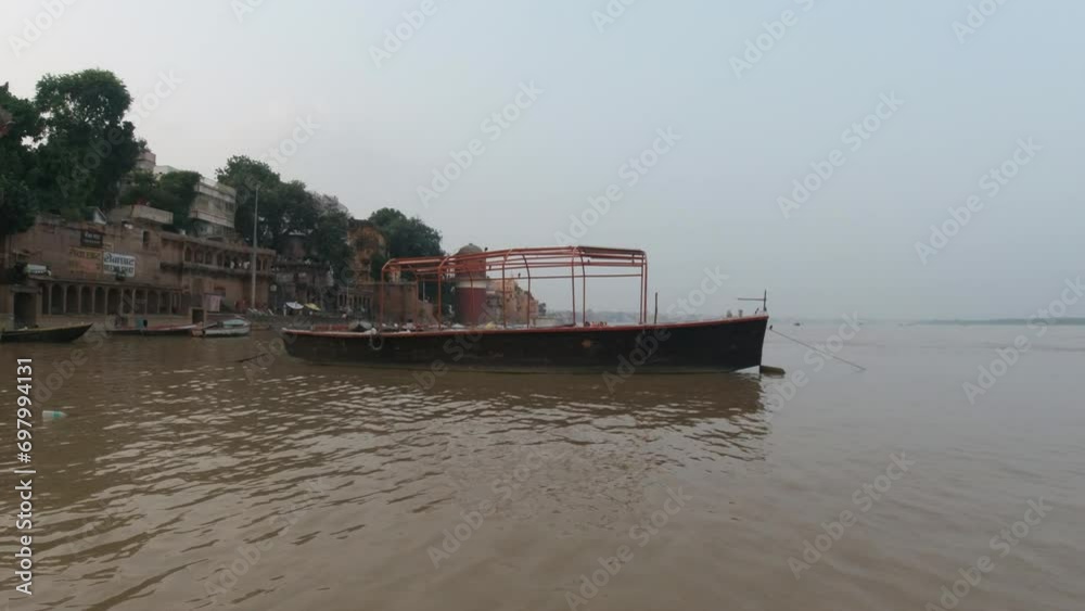 Cinematic sunset scenic boat pan right Ancient Holy city Varanasi India Ganges River canal boat cruise Northern State people at Ghat Pradesh Province landscape gray cloudy Cinematic sunset scenic boat pan right Ancient Holy city Varanasi India Ganges River canal boat cruise Northern State people at Ghat Pradesh Province landscape gray cloudy
