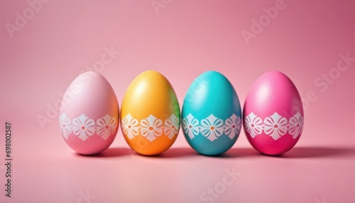  a group of colorful easter eggs sitting on top of a pink surface with a white lace design on one of the eggs and a white lace design on the side of the eggs.