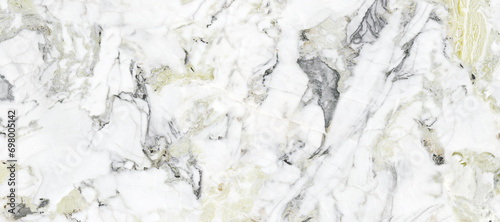 White marble background with golden spider veins on surface. High quality quartz stone marble for wall tile and kitchen tile ceramic surface. Polished satvario natural granite marbel with smooth. photo
