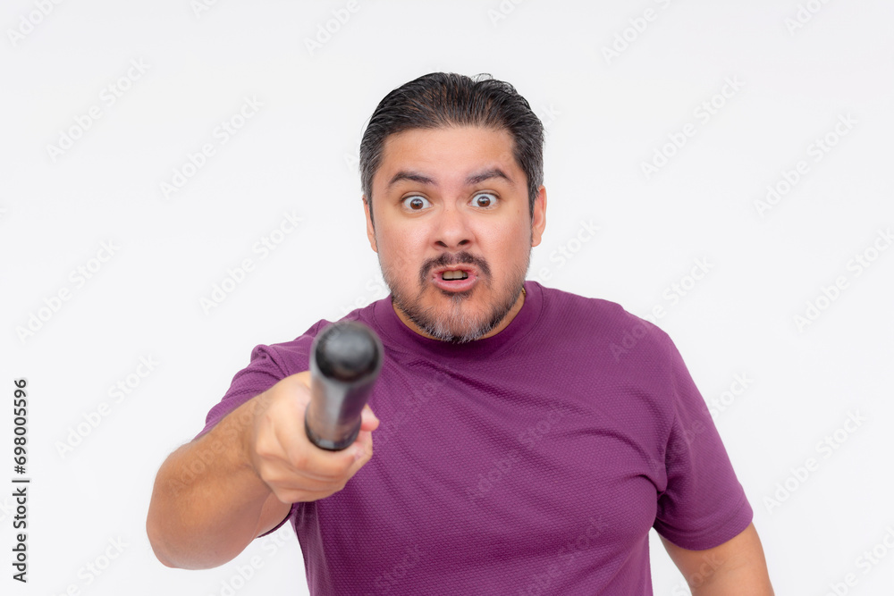 An angry man pointing at someone with a baton. Hostile person intimidating with a blunt weapon. Isolated on a white background. An angry man pointing at someone with a baton. Hostile person intimidating with a blunt weapon. Isolated on a white background.