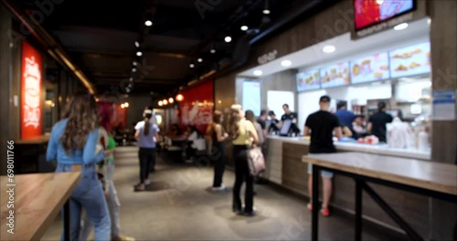 A Group of People Ordering from the Fast Food restaurant. Blurred background 4K video