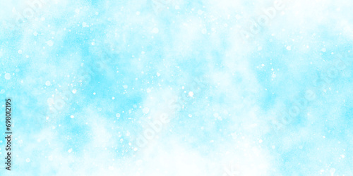 abstract bokeh glitter background on blurred blue texture, sunshine or sparkling lights and glittering glow winter morning of snow falling background, A shiny holiday card with bokeh, blue grunge. 