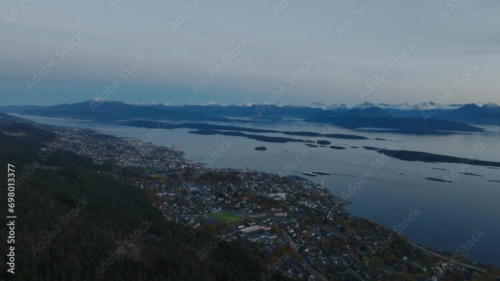 aerial view over molde with ferry in bay with mountains on background in norway aerial view over molde with ferry in bay with mountains on background in norway