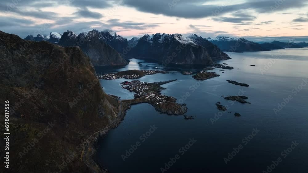 aerial view of reine village on lofoten islands with mountains on background during sunrise in norway aerial view of reine village on lofoten islands with mountains on background during sunrise in norway