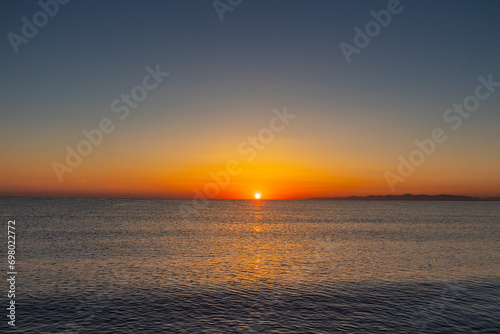 Sunset over the Ocean with Mountains in the Background, Tunisia © Khaled