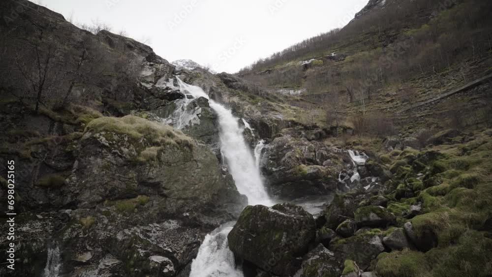 Kleivafossen waterfall at briksdalsbreen glacier in norway in slow motion