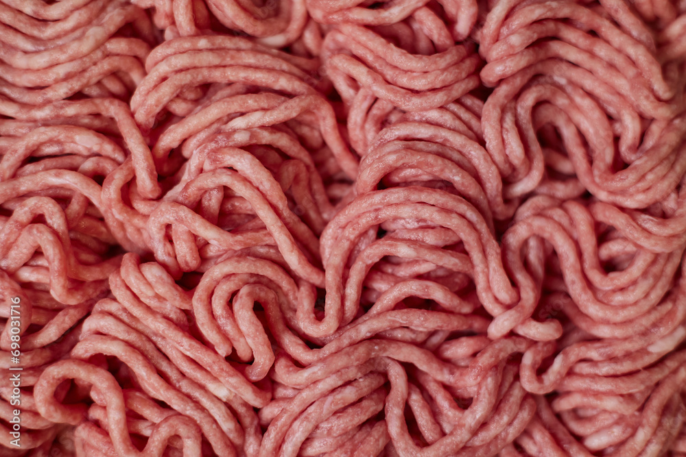 Fresh pork minced meat texture background. Top view of raw pork forcemeat. Fresh pork minced meat texture background. Top view of raw pork forcemeat.