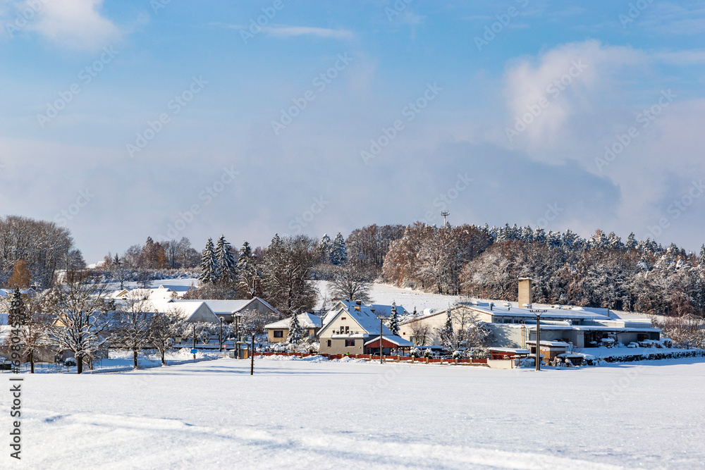 Snow-covered village after heavy snowfall in central Europe