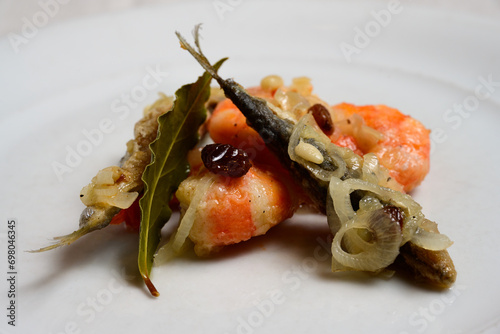 Sarde e Gamberi in Saor, Venetian Marinated Shrimps or Prawns and Sardines with Onions, Raisins, Pine Nuts, Spices and Sweet and Sour Marinade photo
