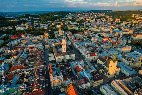 Rooftops of the old town in Lviv in Ukraine. The magical atmosphere of the European city. Landmark, the city hall and the main square. Drone photo. photo