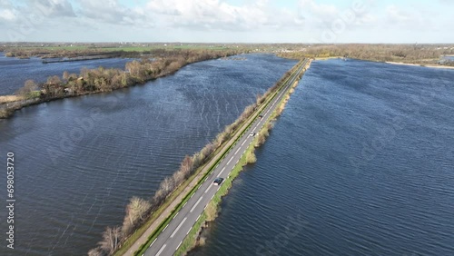 Wallpaper Mural Drone footage of cars driving on roads on Reeuwijkse plassen lake on a sunny day in the Netherlands Torontodigital.ca