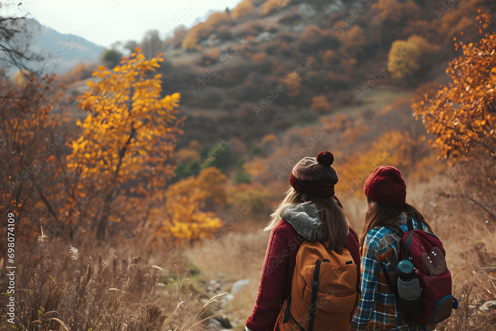 group of kids walking in the mountain wearing backpacks