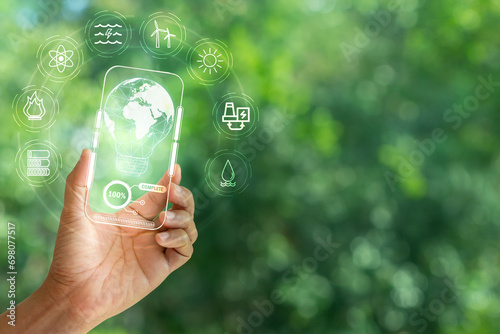Hand holding and showing transparent tablet device. Business  natural green bokeh background technology concept alternative energy conservative clean energy .
