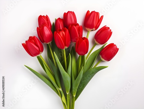 A bunch of red tulip flowers on a white table 