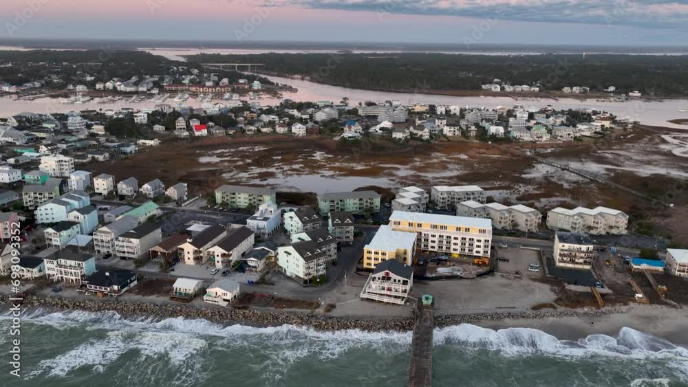 Aerial view of a residential area in Carolina Beach, NC during sunrise. Aerial view of a residential area in Carolina Beach, NC during sunrise.