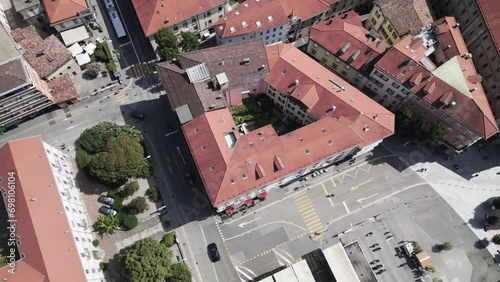 Aerial view over the streets of Lugano, Switzerland. City center, cars moving, red rooftops. photo