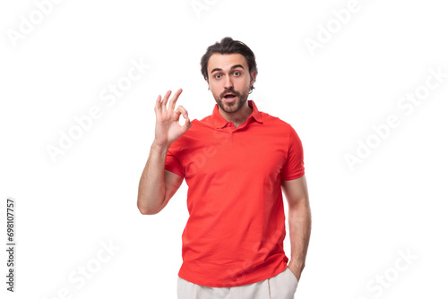 young confident handsome european brunette man with beard dressed in red t-shirt with fabric print mockup