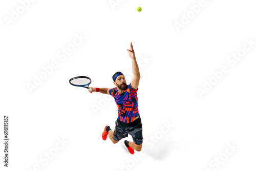 Concentrated athletic man, tennis player during game, hitting ball with racket isolated over white background. Dynamics. Concept of professional sport, movement, competition, action. Ad © master1305