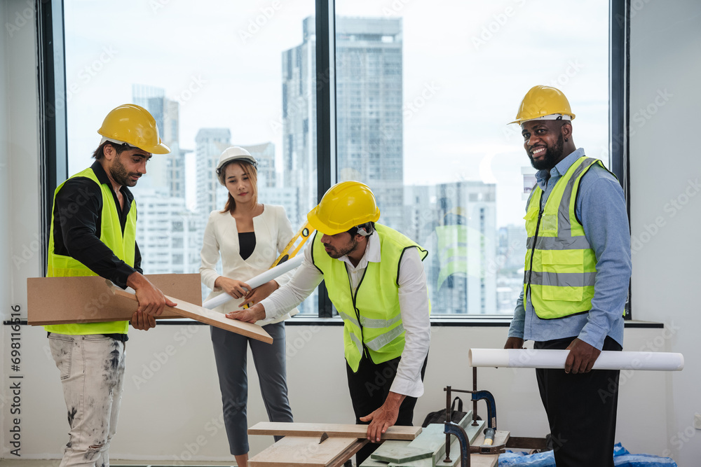 Engineers meet in the office to work on an architectural project as a team. Team of Professionals Engaged in Architectural Project Planning and Design.