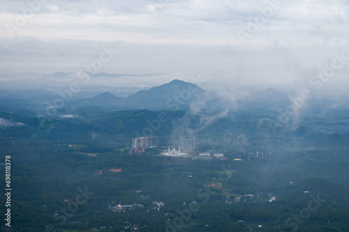 Long view of Mosque in a valley under clouds from Knowledge city, Calicut, Kerala 