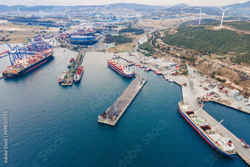 Cargo ships loading and unloading in commercial cargo sea port  Aerial view of business logistic import and export freight transportation by container ship