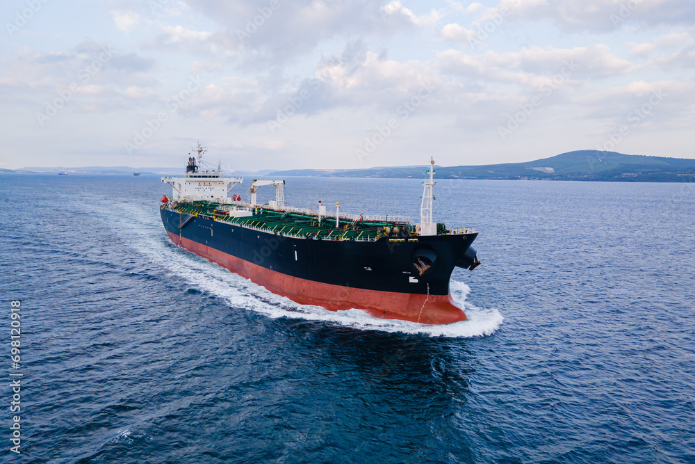 Cargo bulk vessel or ship is going at sea in Dardanelles maritime waterway, Aerial view