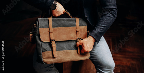 hipster man with stylish shoulder bag. lifestyle, fashion, style and people concept photo