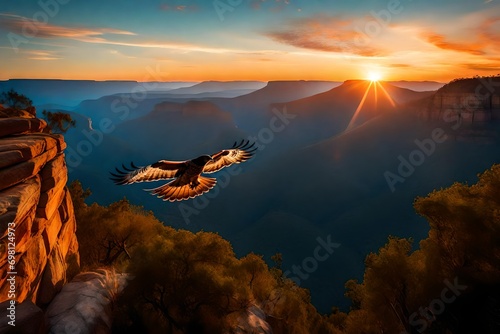 Flying over the blue mountains and sunset sky is a red-tailed hawk © Stone Shoaib