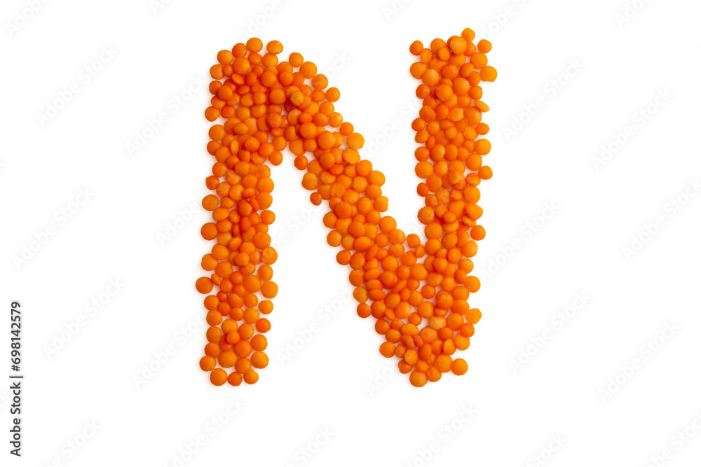 The capital letter 'N' formed from red lentil grains against a clean white backdrop. Perfect for a food blog and menu The capital letter 'N' formed from red lentil grains against a clean white backdrop. Perfect for a food blog and menu